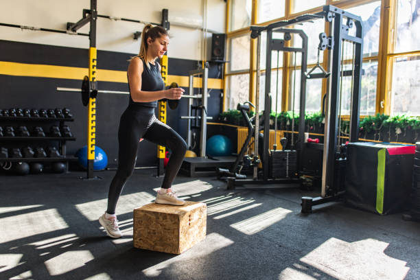 istock Woman exercising in gym 2148799180