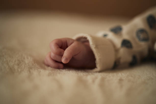 Close up of baby’s hand.