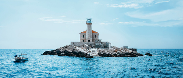 Panoramic view of a beautiful lighthouse in the mediterranean sea of Croatia in a sunny day during summer.
