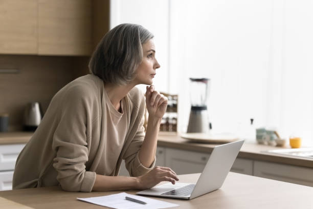 istock Serious woman work on laptop thinking on online business project 2148802821