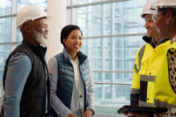 istock Construction workers and discussion in office with tablet for job, management or meeting with colleagues. Group of people, indoors and talking with team for renovation or architecture or development 2148803560