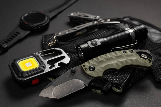 istock Everyday carry EDC items for men in black color - tactical knife, flashlight, watch and silver multi tool. Survival set. 2148803703