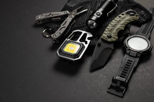 istock Everyday carry EDC items for men in black color - tactical knife, flashlight, watch and silver multi tool. Survival set. 2148803755