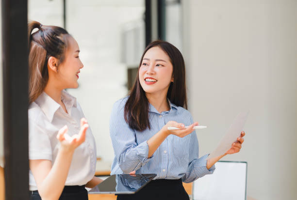 istock Two businesspeople or marketing team analyzing data charts, graphs, and prepare a statistical report and discuss financial data in office. 2148804509
