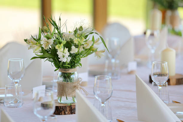 istock White flowers decorated on the table for event party or wedding reception 2148805122