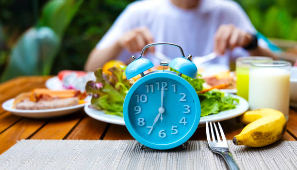 istock Alarm clock with IF (Intermittent Fasting) 16 and 8 diet rule and weight loss concept.-Diet plan concept 2148805344