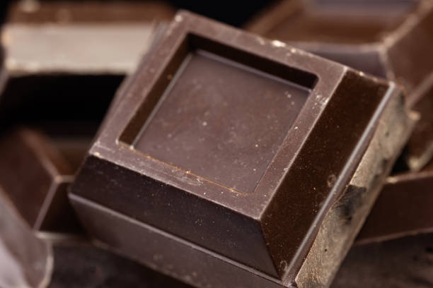 istock Broken chocolate. Chocolate pieces. Chocolate pieces on dark background. 2148805633