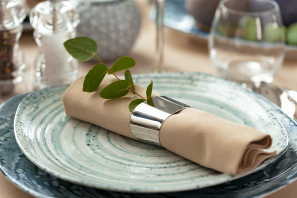 istock Stylish serving on a green ceramic plate with cotton napkin 2148805947