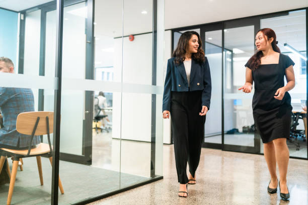 istock Business partners walking together and talking. 2148807733