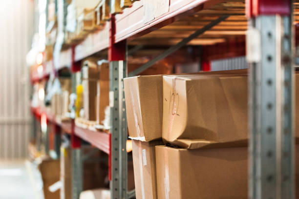istock Modern warehouse shelves with pile of cardboard boxes 2148809031