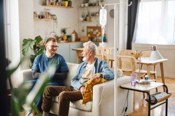 istock Male nurse talking with a senior patient 2148809201