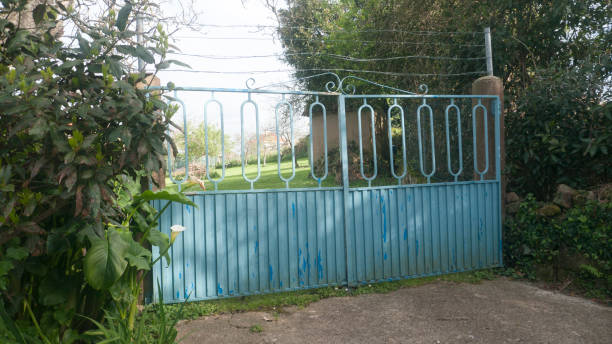 istock Blue metal gate in country house 2148810326