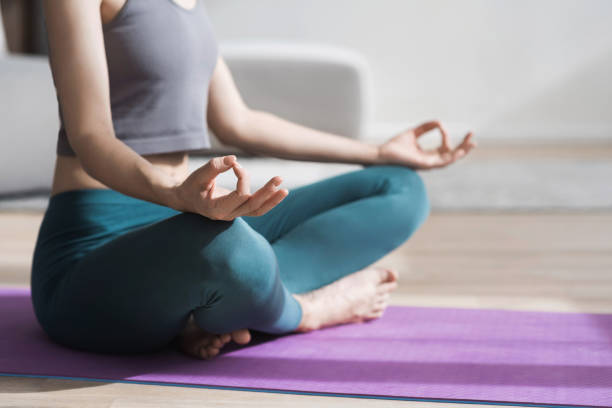 istock Woman practicing yoga, meditating at home 2148811347