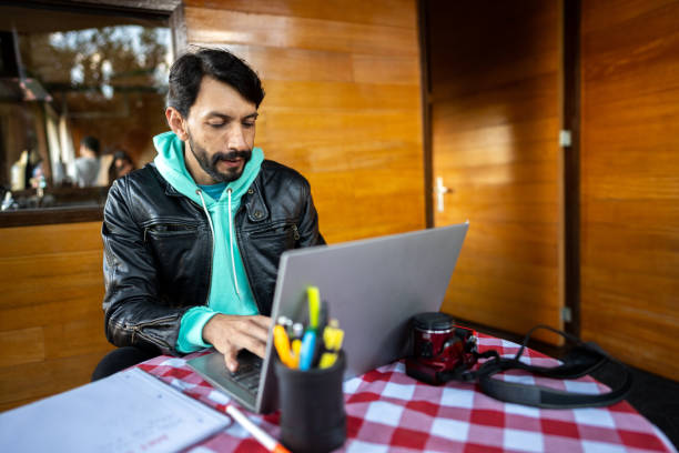 istock Photographer mature man working using laptop at home 2148811641