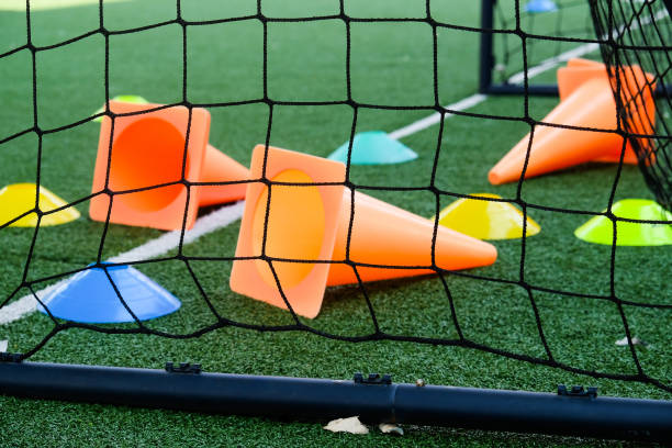 istock Soccer goal and cones on green artificial turf 2148811736