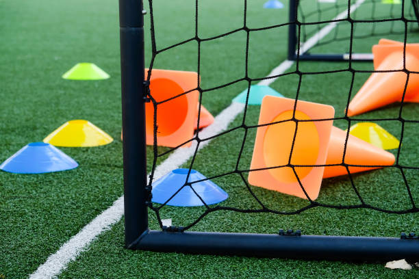 istock Soccer goal and cones on green artificial turf 2148811769