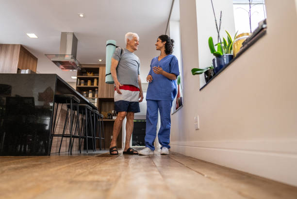 istock Physiotherapist talking to a senior patient at home 2148812204