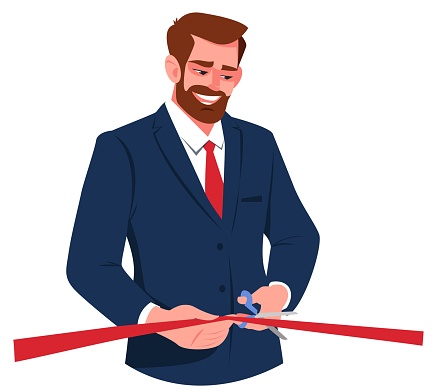 Businessman cuts the red ribbon