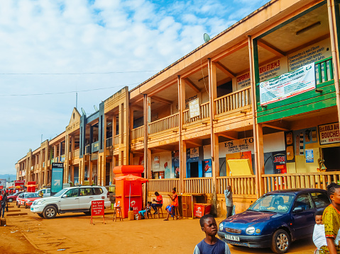 Sossi, Republic Of Congo - March 14, 2023 : Orange house on the street in Sossi in Congo.