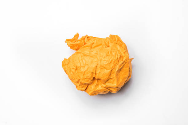 Closeup view of colored crumpled paper isolated over a white background