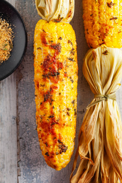 istock Grilled Corn Cob with Herbs and Cheese. Corn On The Cob. Corn. Sweet yellow corn. Fresh corn with spice. Barbecue and grilled corn with cheese. 2148814693