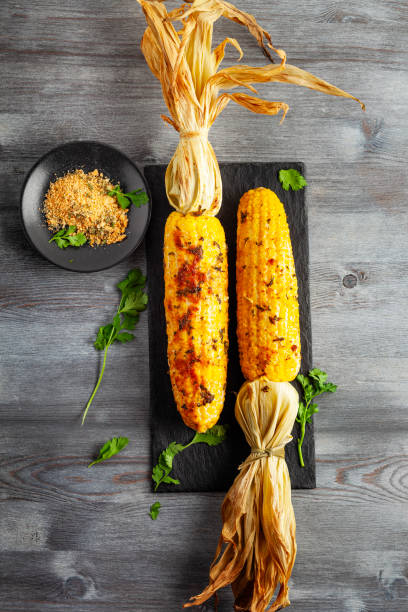 istock Grilled Corn Cob with Herbs and Cheese. Corn On The Cob. Corn. Sweet yellow corn. Fresh corn with spice. Barbecue and grilled corn with cheese. 2148814925
