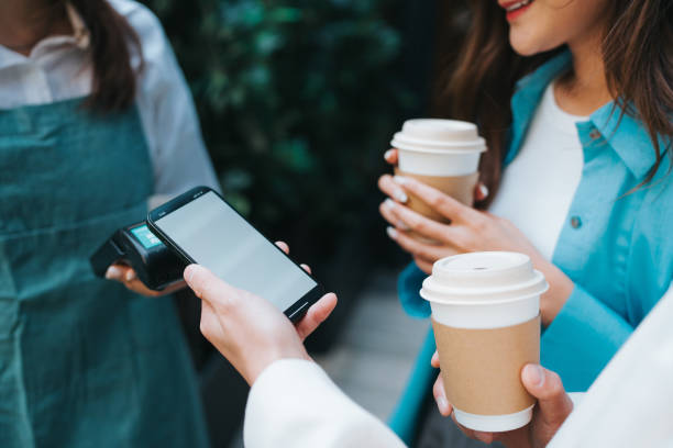 istock Customer Completes Purchase with Smartphone Contactless Payment 2148816115
