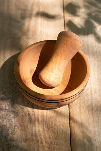 Mortar and pestle on wooden table