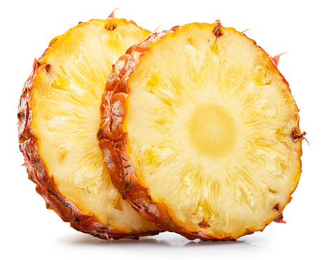 Ripe pineapple cross section slices on white background. File contains clipping path.