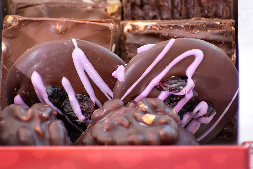 variety of mouth-watering chocolate creations made with high-quality ingredients and innovative techniques, appealing to chocolate enthusiasts seeking unique and delicious treats.
