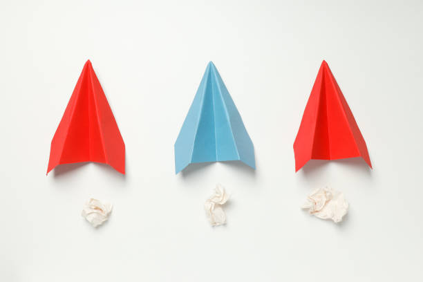 Business, startup and sponsorship concept with paper planes on white background