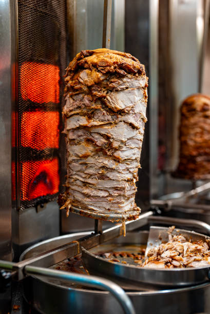 istock Juicy meat is fried on a shawarma spit. 2148820617