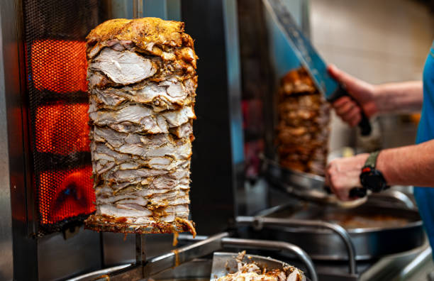 istock Juicy meat is fried on a shawarma spit. 2148820624