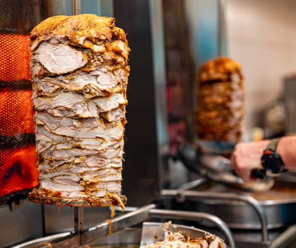 istock Juicy meat is fried on a shawarma spit. 2148820627