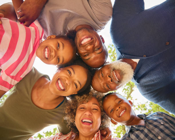 istock Portrait Of Three Generation Family Outdoors Looking Down Into Camera 2148820868