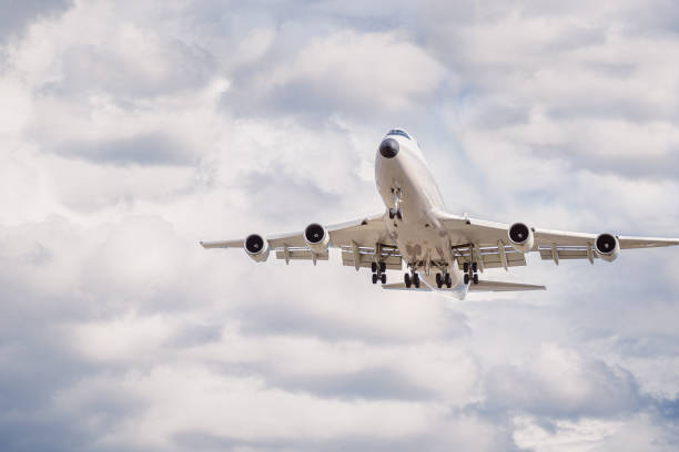 istock A massive cargo plane is preparing to land amidst the clouds. Landing airplane. 2148822111