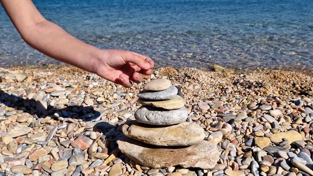 Balance stones. Pebbles on the beach by the sea.