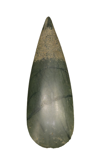 Neolithic polished stone axe, polished jadeite axehead on white background
