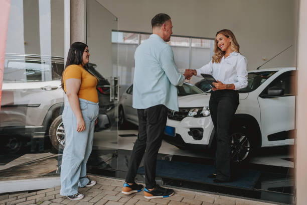 istock Father with daughter buys a car 2148823298