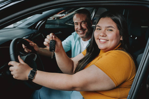 istock Daughter receiving car keys 2148823360