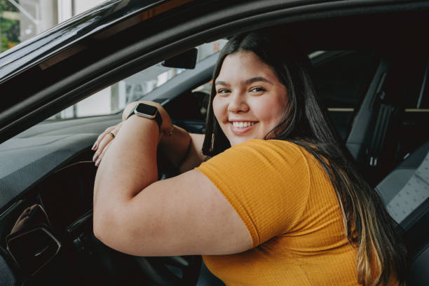 istock Young woman buying a car 2148823361