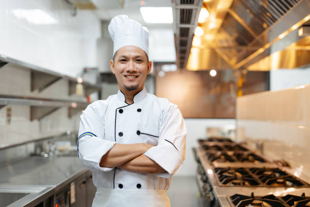 istock Confidence Asian chef standing and arms crossed in kitchen 2148823463