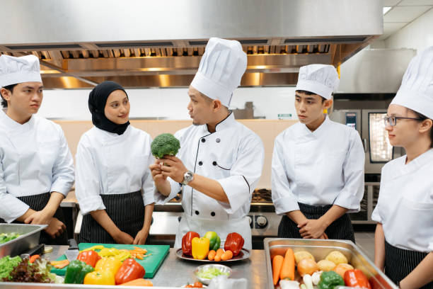 istock Chef conduct a cooking class in commercial kitchen 2148823507