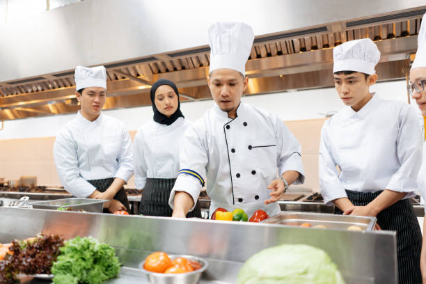 istock Professional chef conduct a cooking class in commercial kitchen 2148823538