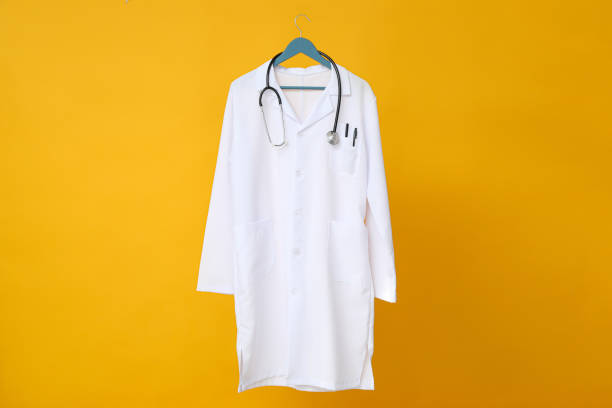 istock A doctor's white coat with a stethoscope on a yellow background 2148824575