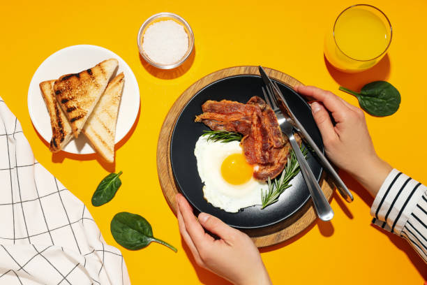 istock Fried bacon and egg - tasty breakfast, top view 2148825030