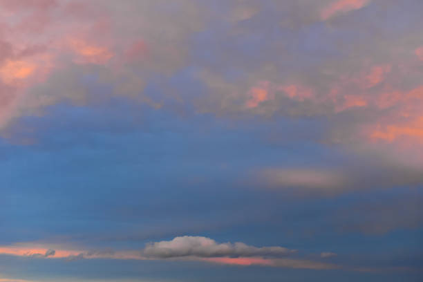 Beautiful scenic blue orange grey cloudscape with a grey cloud sky background