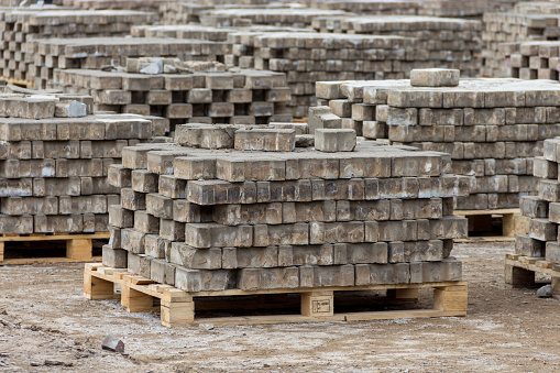 Uralsk, Oral, Kazakhstan (Qazaqstan), 26.03.2020 - Deposited paving stones on wooden pallets on Abay Square in the city of Uralsk. Disassembled paving stones stacked on pallets.