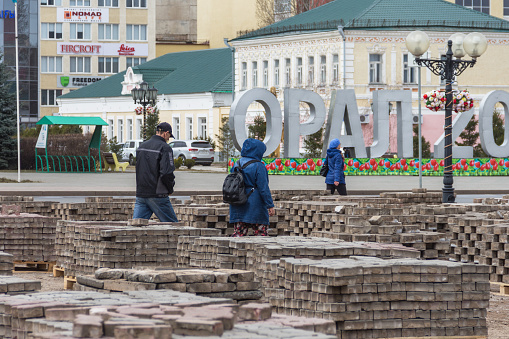 Uralsk, Oral, Kazakhstan (Qazaqstan), 26.03.2020 - Deposited paving stones on Abai Square in the city of Uralsk. Disassembled paving stones stacked on pallets.