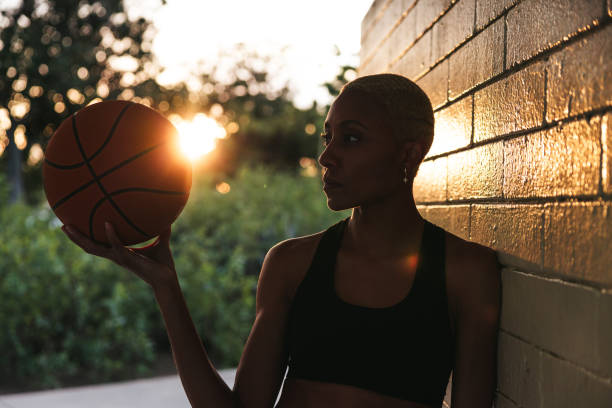 istock Basketball player portrait in silhouette at sunset 2148827317